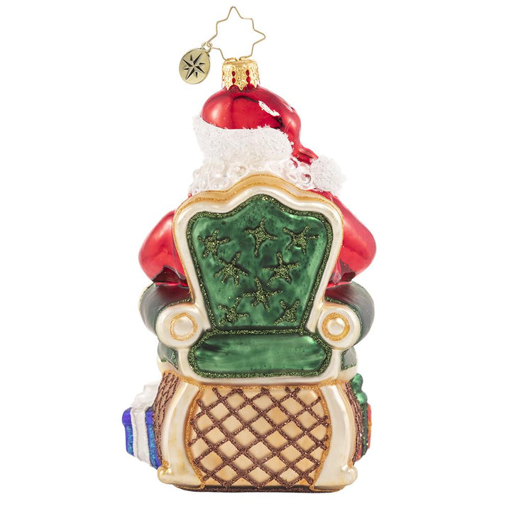 Back - Ornament Description - Santa's Lap of Luxury: Santa relaxes on his signature velvet chair, ready to hear the wishes of countless good little boys and girls. Naughty or nice, Santa always delivers!