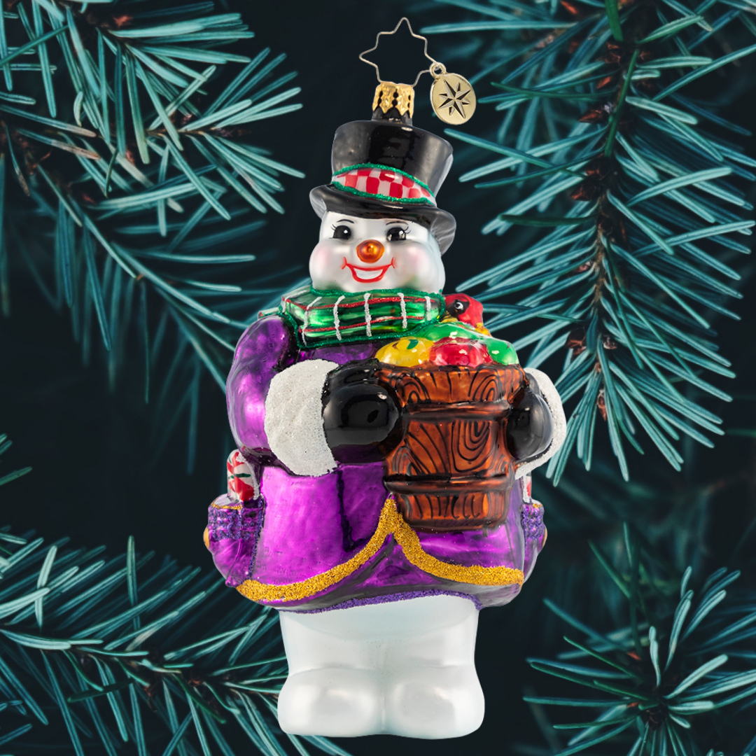 Ornament Description - How 'Bout Them Apples?: You cannot have hot apple cider without apples, right? This snowman is doing his part to make sure there is plenty to go around this holiday.