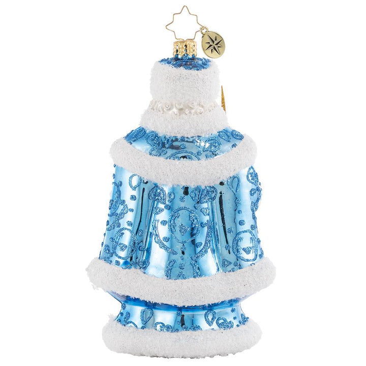 Back - Ornament Description - Spiffy For the Soiree: He is truly the king of Christmas! Looking positively royal in ice-blue regalia, Santa awaits the arrival of his guests at his annual holiday jubilee.