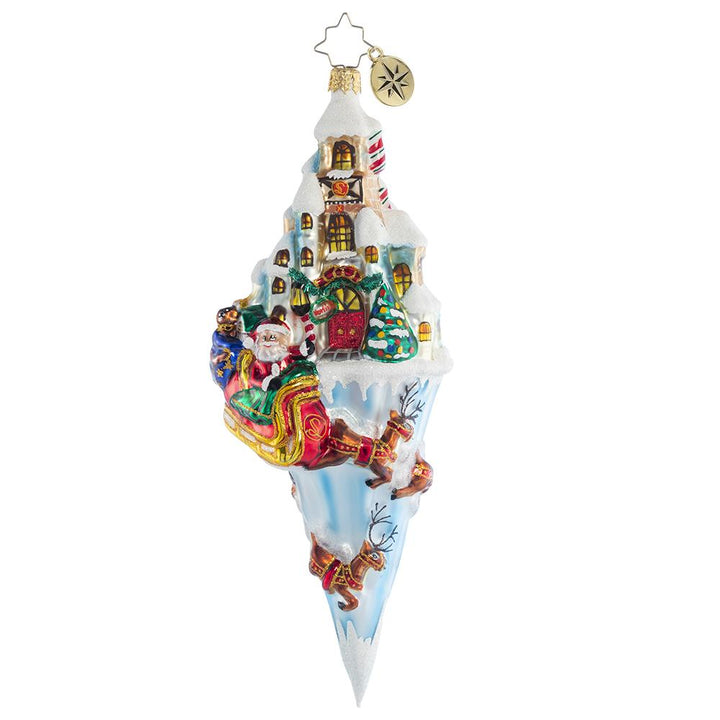 Ornament Description - Paradise On Ice: Nestled in the heart of the North Pole, Santa's charming workshop is where all the Christmas magic happens. As the reindeer pull him into the night air, he watches it twinkle from above.