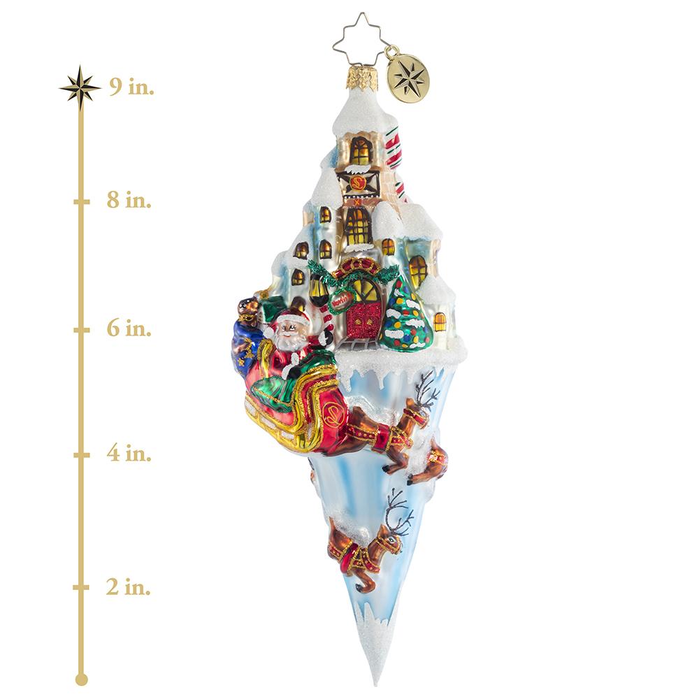 Ornament Description - Paradise On Ice: Nestled in the heart of the North Pole, Santa's charming workshop is where all the Christmas magic happens. As the reindeer pull him into the night air, he watches it twinkle from above. This photo shows the ornament is about 9 inches tall. 