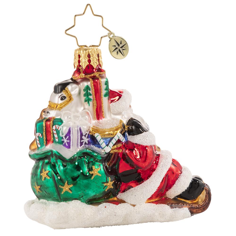 Back - Ornament Description - Timely Toboggan Delivery! Gem: Santa won't let a little thing like air traffic slow him down, so he's ditched the sleigh and taken to the slopes on his trusty toboggan instead. Look out below