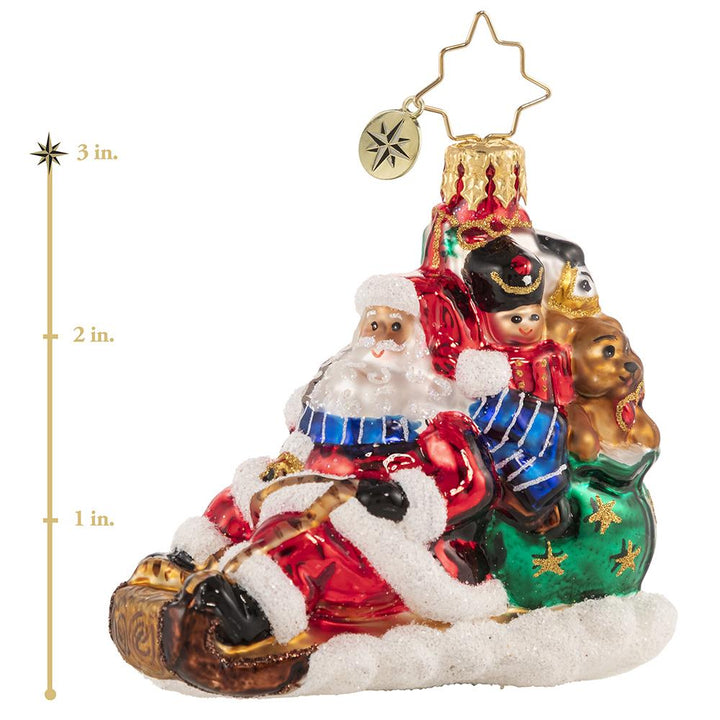 Ornament Description - Timely Toboggan Delivery! Gem: Santa won't let a little thing like air traffic slow him down, so he's ditched the sleigh and taken to the slopes on his trusty toboggan instead. Look out below! This photo shows the ornament is about 3 inches tall. 