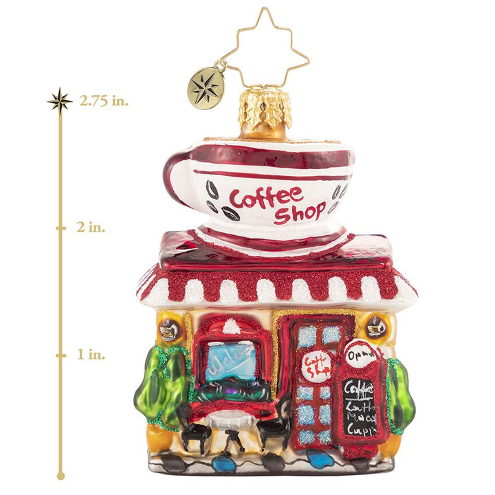 Ornament Description - Wake Up And Smell The Coffee Gem: You know what they say-- a bad day with coffee is better than a good day without it! Rain or shine, this miniature coffee shop works hard to make sure everyone can get their fix! This photo shows the ornament is about 2.75 inches tall. 