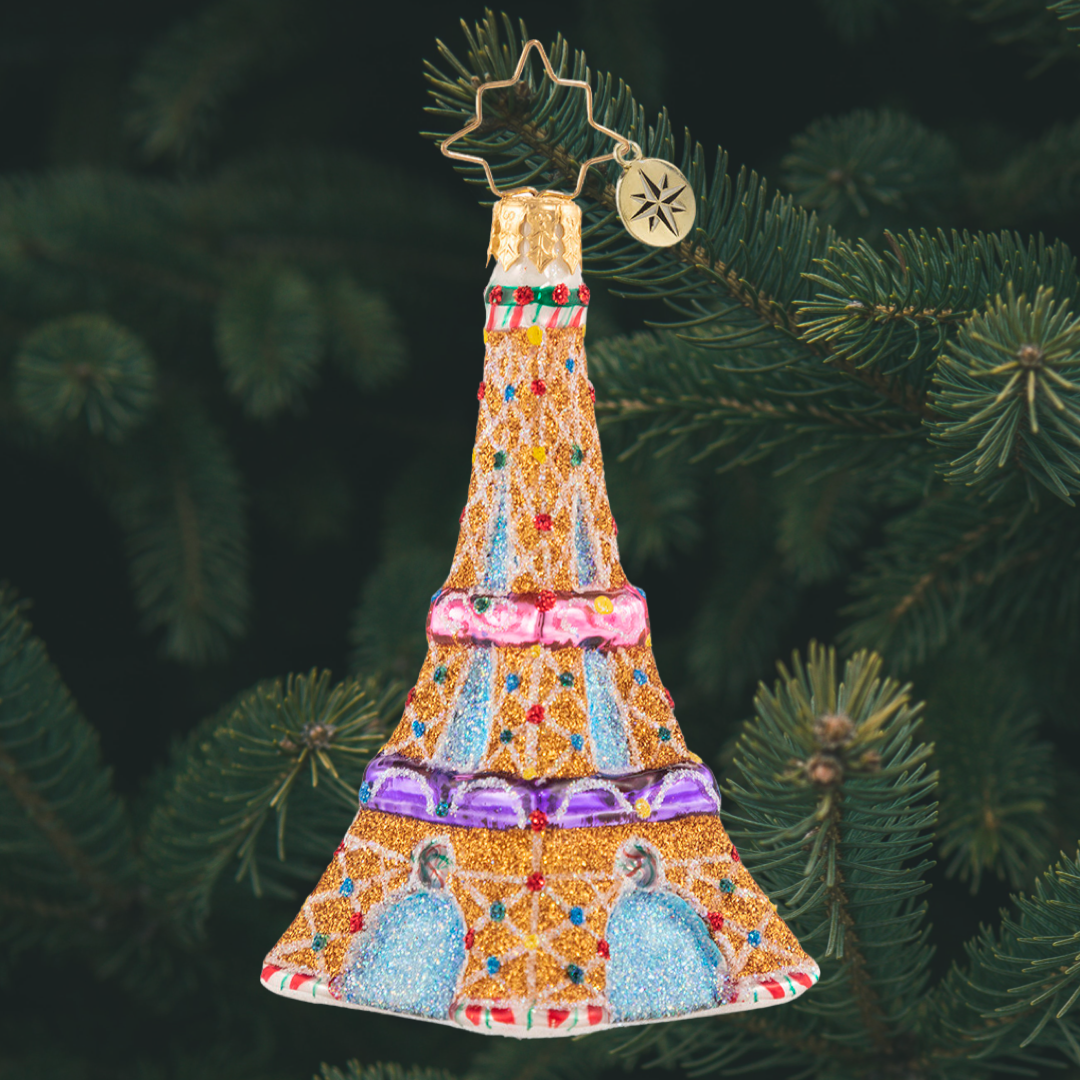 Ornament Description - Paris is Sweet Gem: Climb to the top, just imagine the view! This tiny gingerbread Eiffel Tower is a sweet Parisian dream come true!