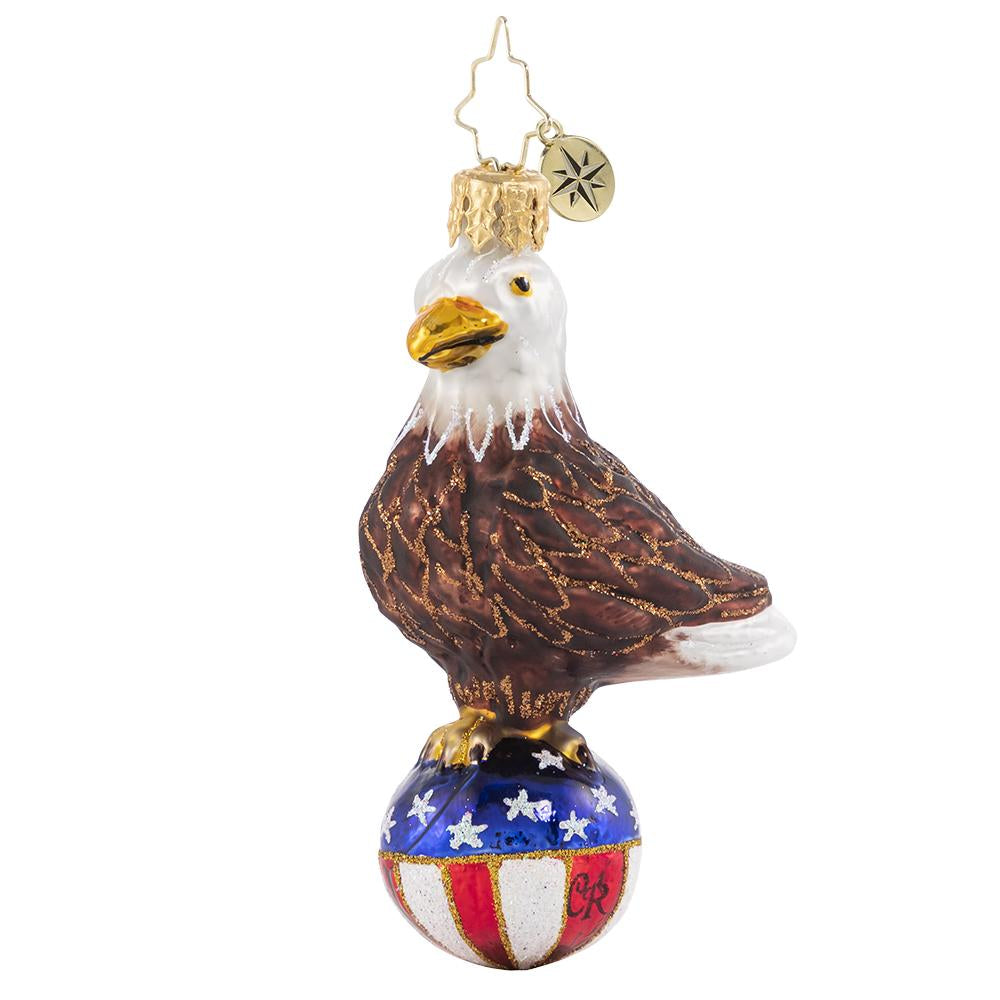 Front - Ornament Description - Stars & Stripes Bald Eagle Gem: Over purple mountains' majesty and above the fruited plainâ€¦there's no question that this little feathered fella is proud to be an American, in the land of the free and the home of the brave!