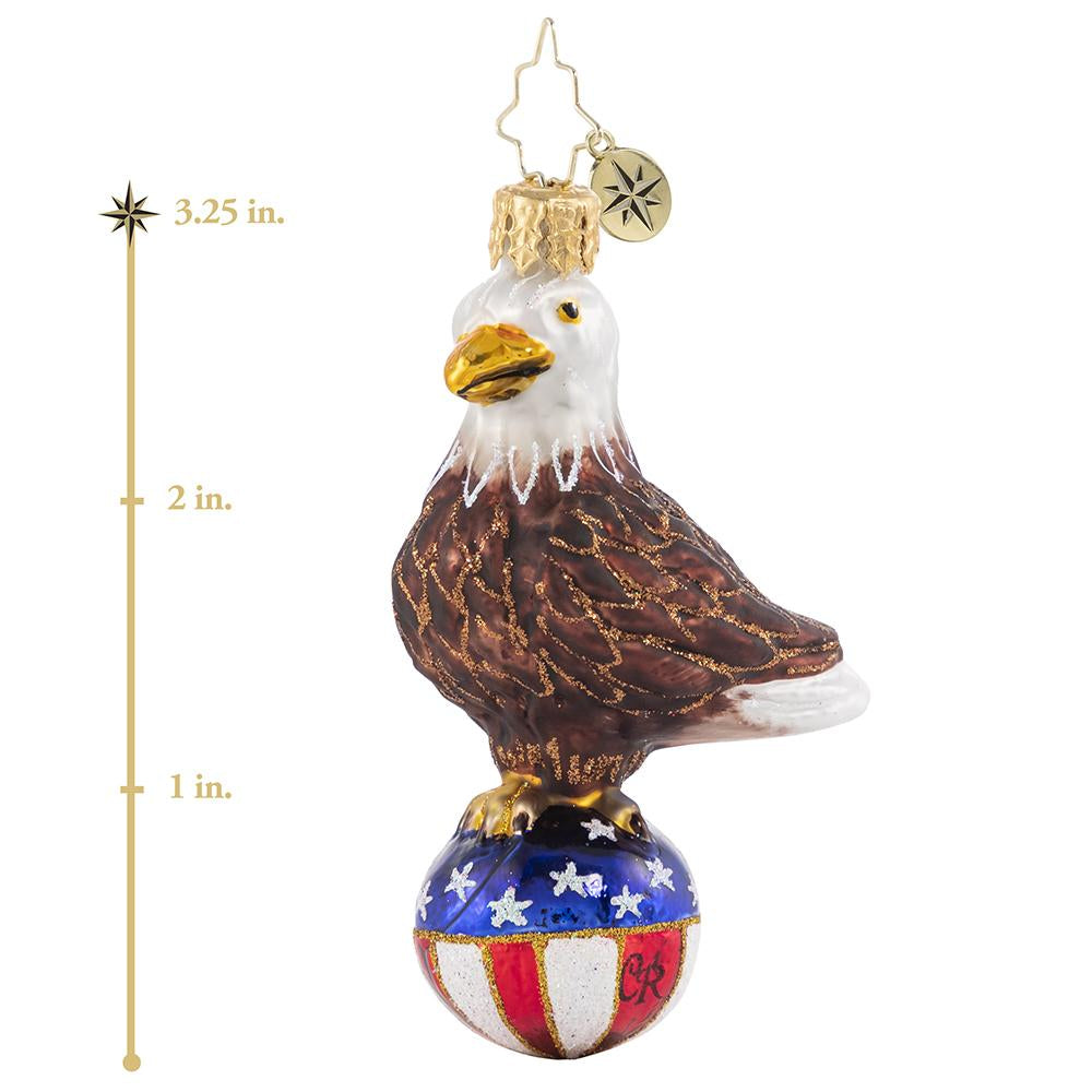 Ornament Description - Stars & Stripes Bald Eagle Gem: Over purple mountains' majesty and above the fruited plainâ€¦there's no question that this little feathered fella is proud to be an American, in the land of the free and the home of the brave! This photo shows the ornament is about 3.25 inches tall. 