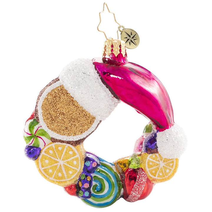 Back - Ornament Description - Swirling With Sweets Wreath Gem: Forget visions of sugarplumsâ€¦between all these swirling lemons, peppermints, and other treats this little gingerbread man is sure to have some very sweet dreams!