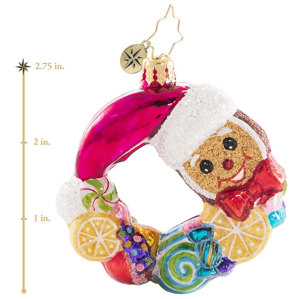 Ornament Description - Swirling With Sweets Wreath Gem: Forget visions of sugarplumsâ€¦between all these swirling lemons, peppermints, and other treats this little gingerbread man is sure to have some very sweet dreams! This photo shows the ornament is about 2.75 inches tall. 