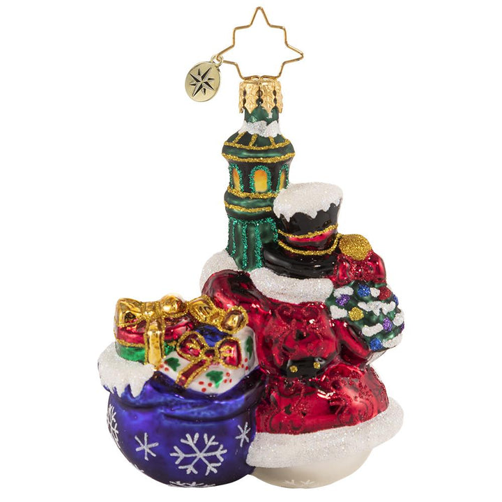Back - Ornament Description - Swinging In The Rain Gem: Everyone's favorite snowman is turning heads in town. Each light pole that he passes, he cannot resist a little swing around!