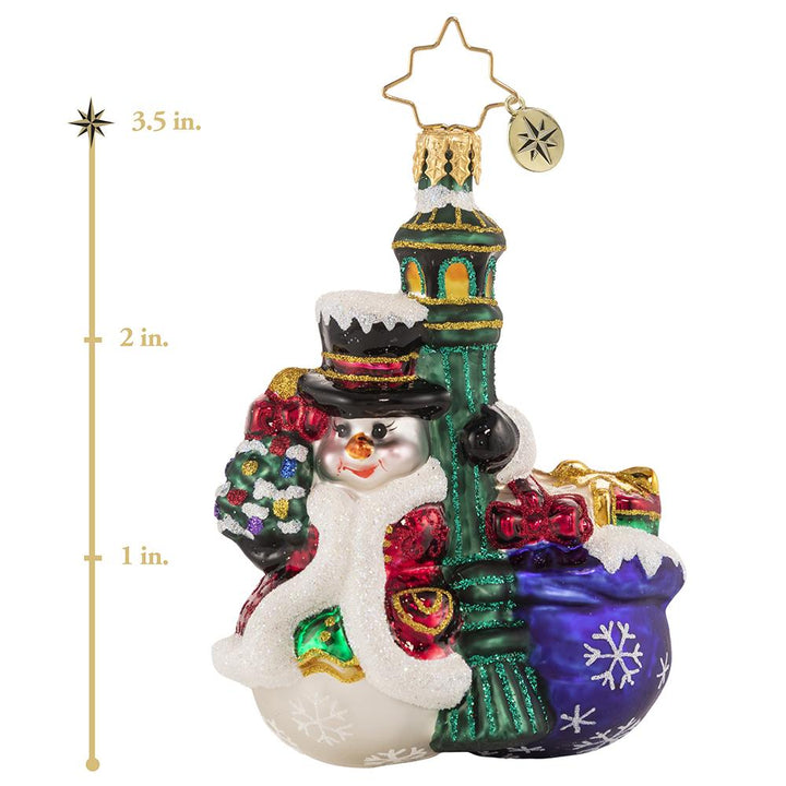 Ornament Description - Swinging In The Rain Gem: Everyone's favorite snowman is turning heads in town. Each light pole that he passes, he cannot resist a little swing around! This photo shows the ornament is about 3.5 inches tall. 