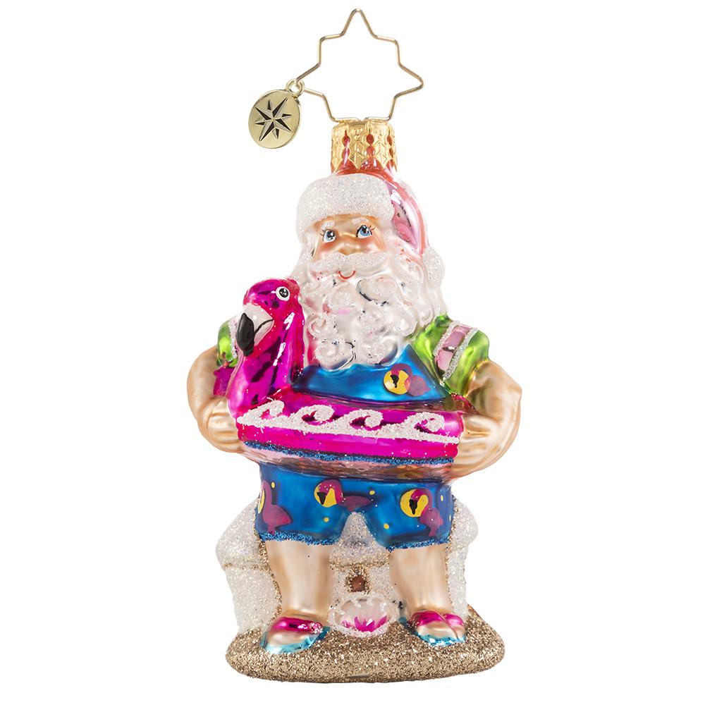 Front - Ornament Description - Out of Office Santa Gem: After his jam-packed holiday season, Santa is relaxing on a well-deserved vacation! He has traded his fur suit for swim shorts and his sack for a flamingo floatie-- he is looking ready for some off-duty fun in the sun!