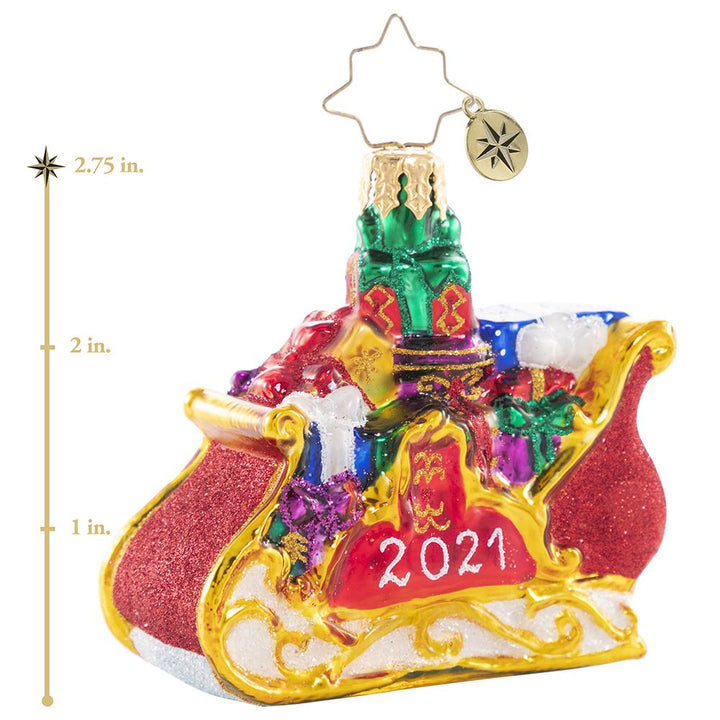 Ornament Description - Precious Cargo 2021 Gem: Ready for takeoff! He has made his list and checked it twice--now the elves have packed up Santa's miniature sleigh in preparation for the biggest night of the year! This photo shows the ornament is about 2.75 inches tall. 