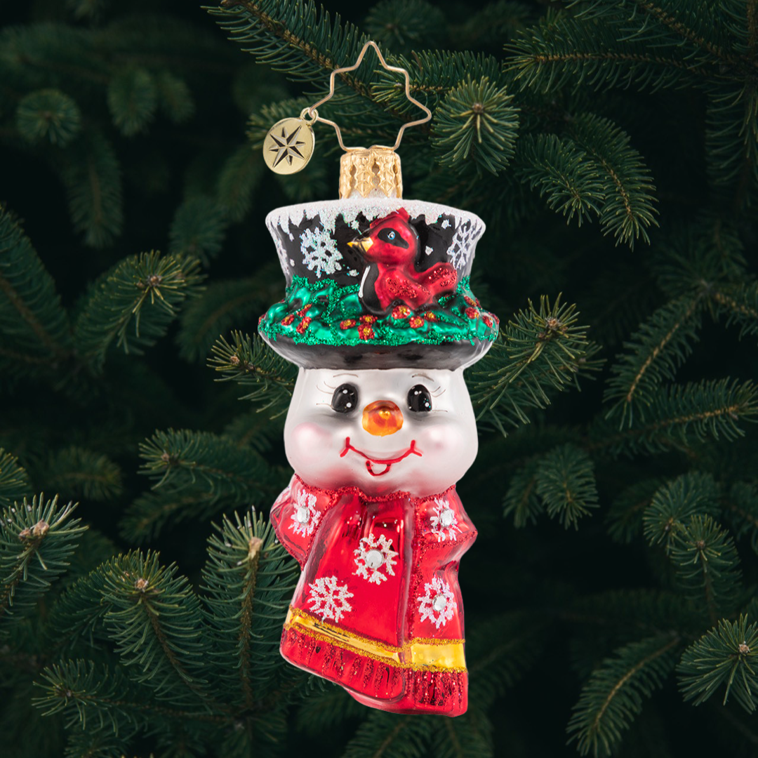 Ornament Description - A Snowman Worth Flocking to Gem: This jolly little snowman has made a feathered friend! A cheerful red cardinal has made himself right at home in Frosty's cap.