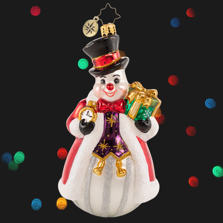Ornament Description - Counting the Minutes 'Til Christmas: It is the most wonderful time of the year! Frosty holds his trusty timepiece and keeps "watch" over all the North Pole holiday preparations. He just cannot wait for the big day!