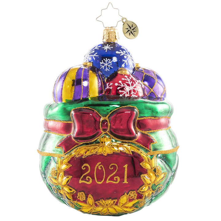 Front - Ornament Description - Cherished Keepsakes 2021: A look back at another year come and gone is much like sorting through this collection of treasured vintage heirloom baubles. As Santa selects a few to hang on this year's tree, he pulls each one out to recall the special memories they evoke, then carefully tucks it away for another year.