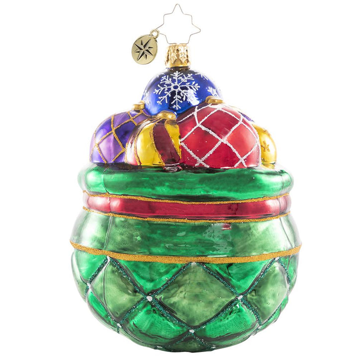 Front - Ornament Description - Cherished Keepsakes 2021: A look back at another year come and gone is much like sorting through this collection of treasured vintage heirloom baubles. As Santa selects a few to hang on this year's tree, he pulls each one out to recall the special memories they evoke, then carefully tucks it away for another year.