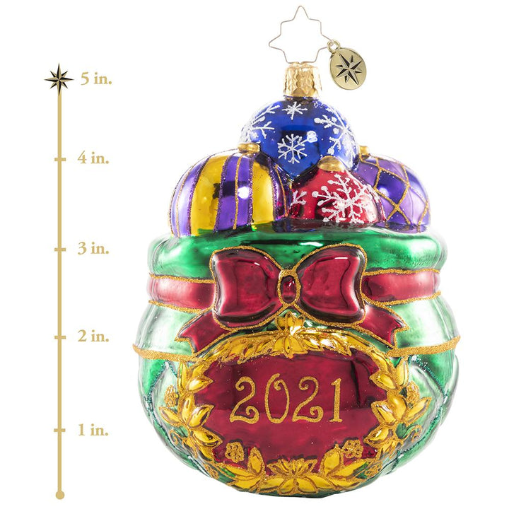 Ornament Description - Cherished Keepsakes 2021: A look back at another year come and gone is much like sorting through this collection of treasured vintage heirloom baubles. As Santa selects a few to hang on this year's tree, he pulls each one out to recall the special memories they evoke, then carefully tucks it away for another year. This photo shows the ornament is about 5 inches tall.