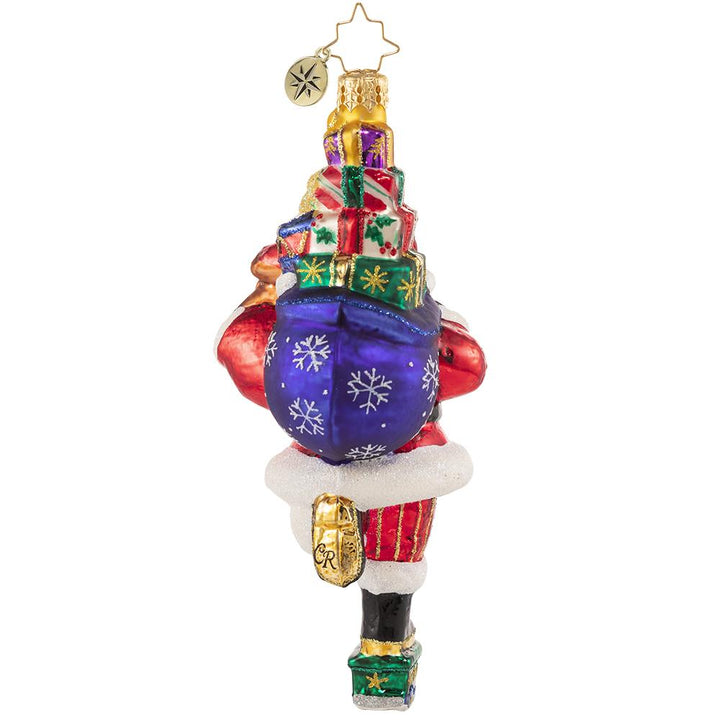 Back - Ornament Description - Traversing By Toy Truck: Does that thing have an engine? Always at the forefront of magical Christmas transportation trends, Santa tries something new; he gives this option a 7 for style, a 6 for speed, and a 10 for fun! 