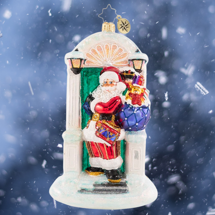 Ornament Description - Knock, Knock... Santa Is Here!: When there is no chimney, use the front door! A stunning Christmas tree awaits Santa just across the threshold of this holiday home.