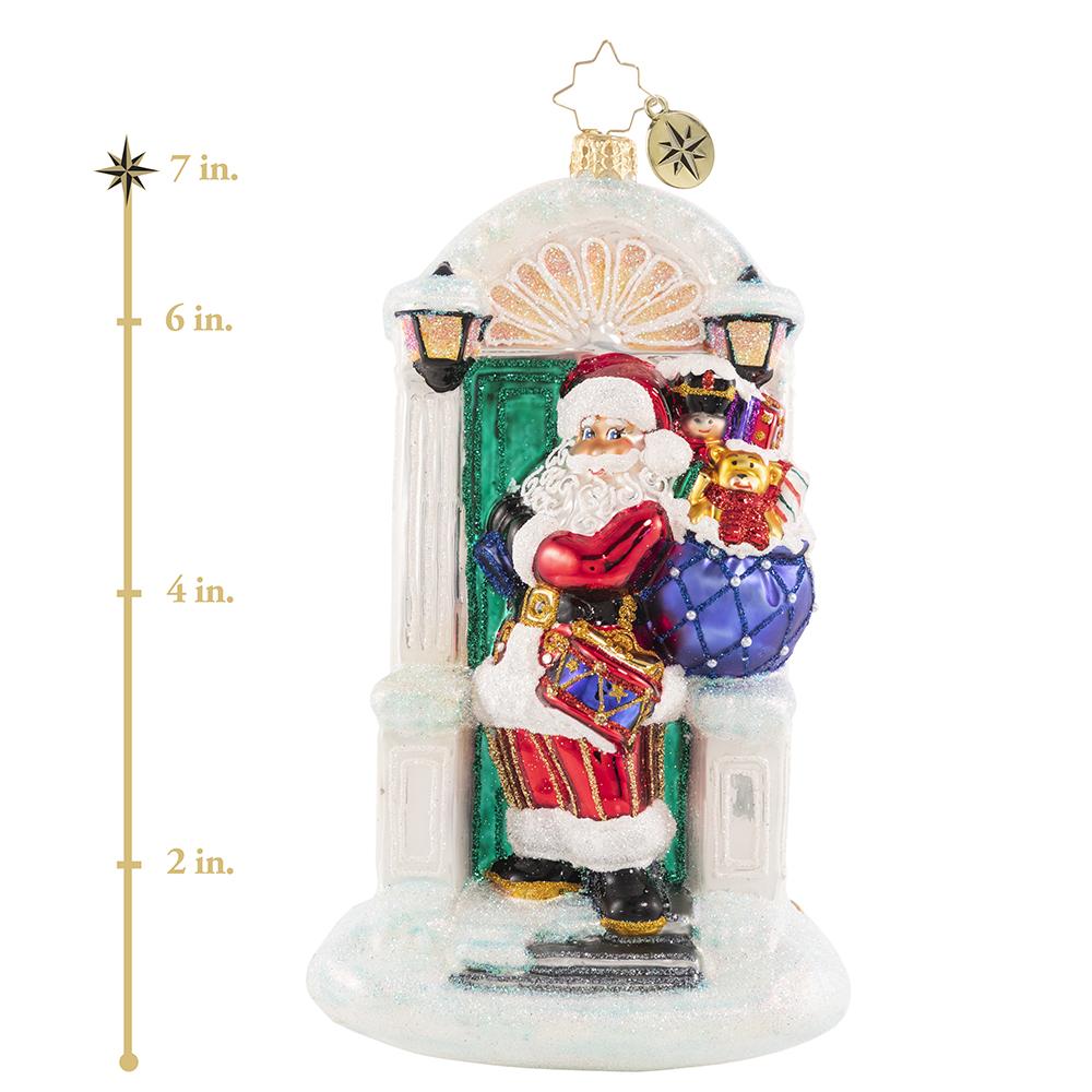 Ornament Description - Knock, Knock... Santa Is Here!: When there is no chimney, use the front door! A stunning Christmas tree awaits Santa just across the threshold of this holiday home. This photo shows the ornament is about 7 inches tall.