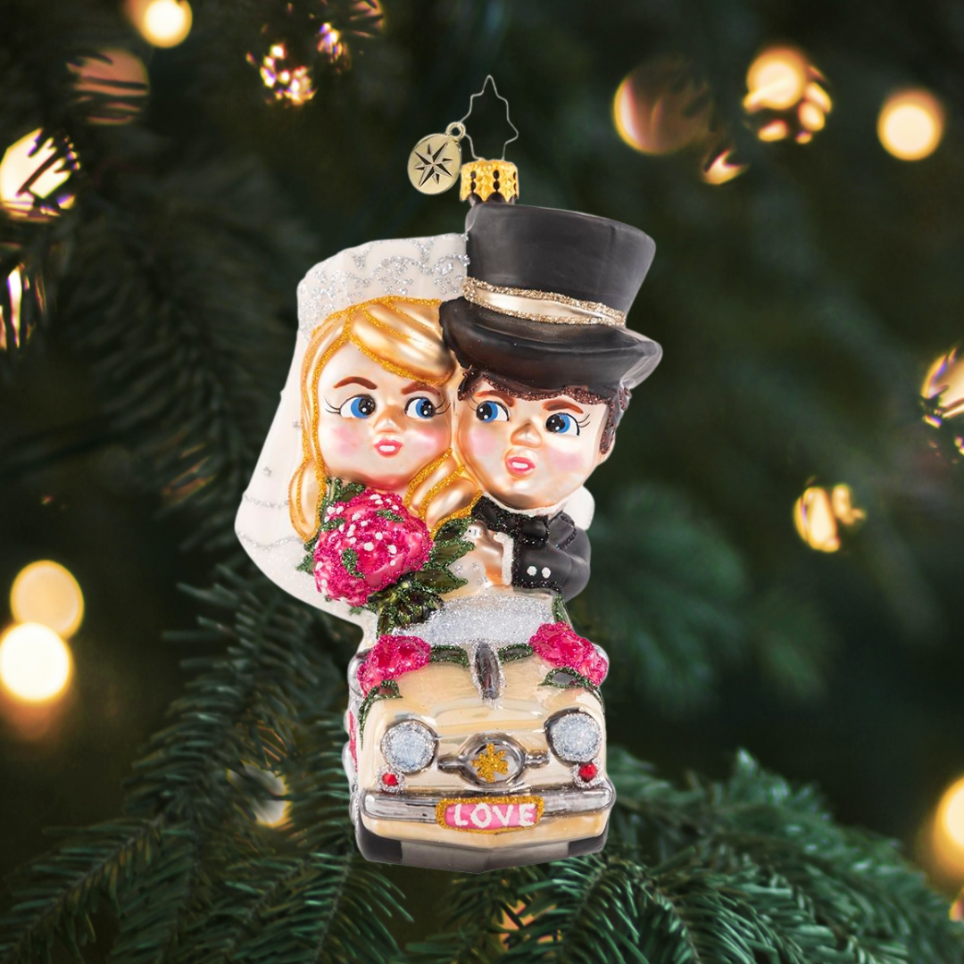 Ornament Description - Riding Merrily in Matrimony: Just Married! These newlyweds are off to their honeymoon in style--we send out best wishes to the new Mr. and Mrs.!