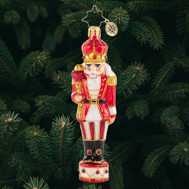 Ornament Description - Drumming Up Delight: No Christmas drumline is complete without its star player! This Major is ready and eager to get "cracking" on this year's practice.