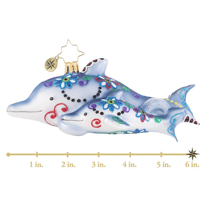 Ornament Description - Swimming Through Florals: This pair of playful dolphins has been gussied up in their finest festive florals of the season. Now they are off to play in the waves! This photo shows the ornament is about 6 inches long. 