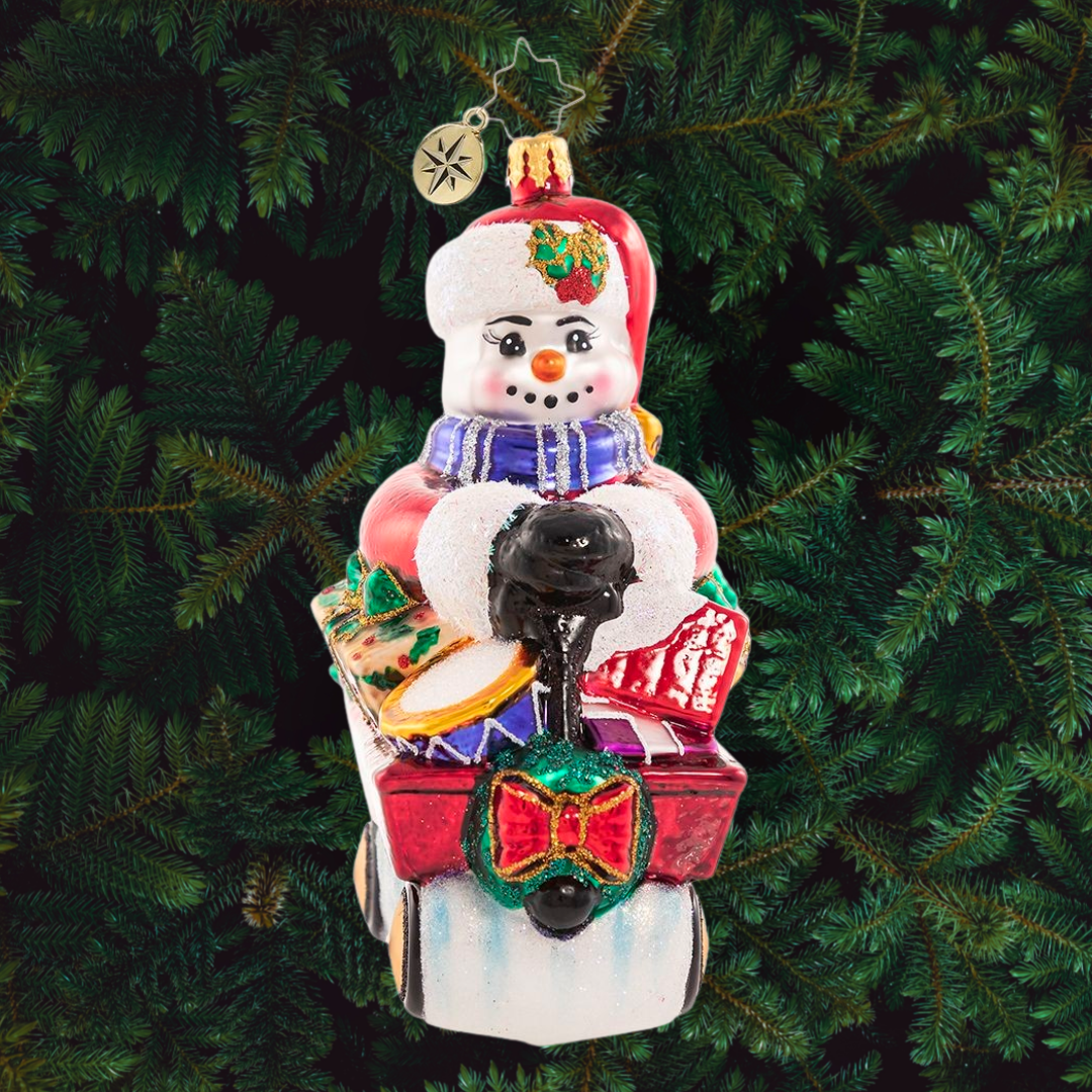 Ornament Description - Wheelin' And Dealin' Snowman: Look at Frosty go! He is wheel-y excited for Christmas and is thumpity-thumping through town in his little red wagon. We hope he got insurance!