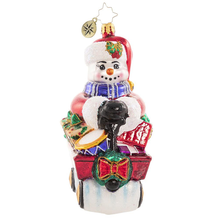 Front - Ornament Description - Wheelin' And Dealin' Snowman: Look at Frosty go! He is wheel-y excited for Christmas and is thumpity-thumping through town in his little red wagon. We hope he got insurance!