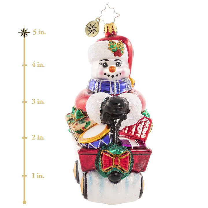Ornament Description - Wheelin' And Dealin' Snowman: Look at Frosty go! He is wheel-y excited for Christmas and is thumpity-thumping through town in his little red wagon. We hope he got insurance! This photo shows the ornament stands about 5 inches tall. 
