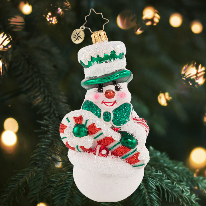 Ornament Department - Candy Cane Entertainer: Encore! This cheeky, cheery chum is here to keep a smile on your face and Christmas magic in your heart all season long. He will do anything for a belly laugh!