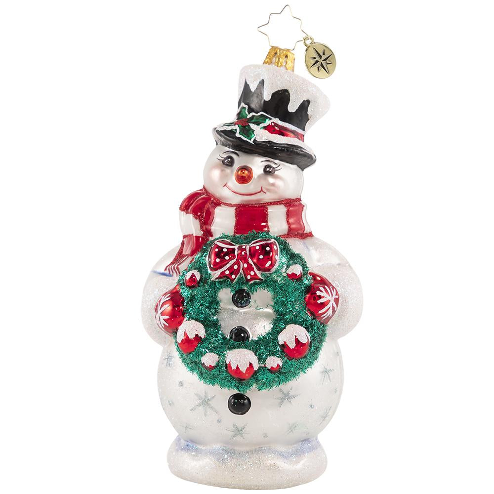 Front - Ornament Description - Darling Christmas Decorator: Deck the halls! Wreath in hand, this sweet snowman is always first to volunteer for holiday decorating duty.