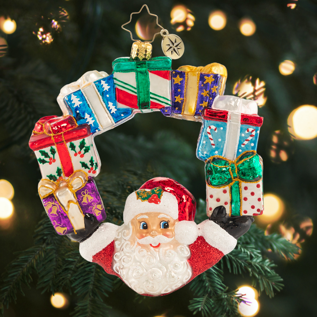 Ornament Description - Ring of Delights: It is all about balance--and Santa always seems to have his hands full. Good thing he is an expert juggler!