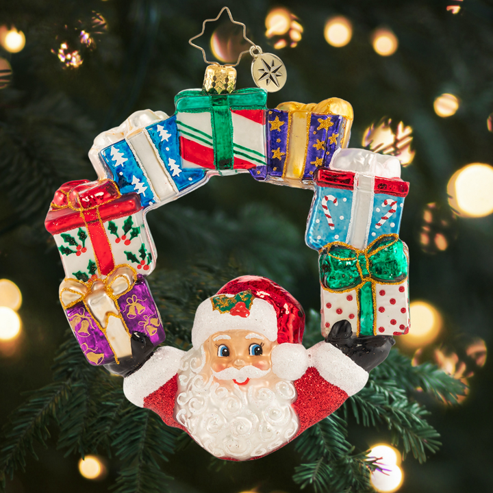 Ornament Description - Ring of Delights: It is all about balance--and Santa always seems to have his hands full. Good thing he is an expert juggler!
