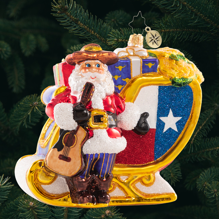 Ornament Description - Santa's Lavish Lone Star Sleigh: Ho-Ho-Howdy partner! Santa shows off his new ride and a fresh new pair of boots. If he starts wearing spurs, we might need to start calling him Tinsel Tex!