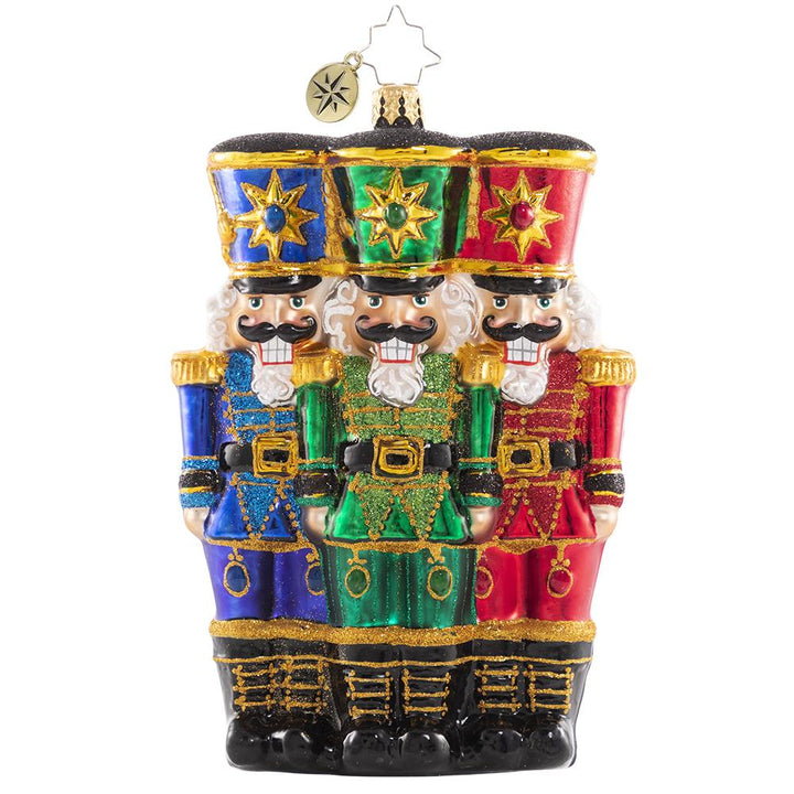 Front - Ornament Description - The Nut-Cracking Pack: These three make a real cracking team! They stand shoulder-to-shoulder in formation as they prepare for their holiday service.
