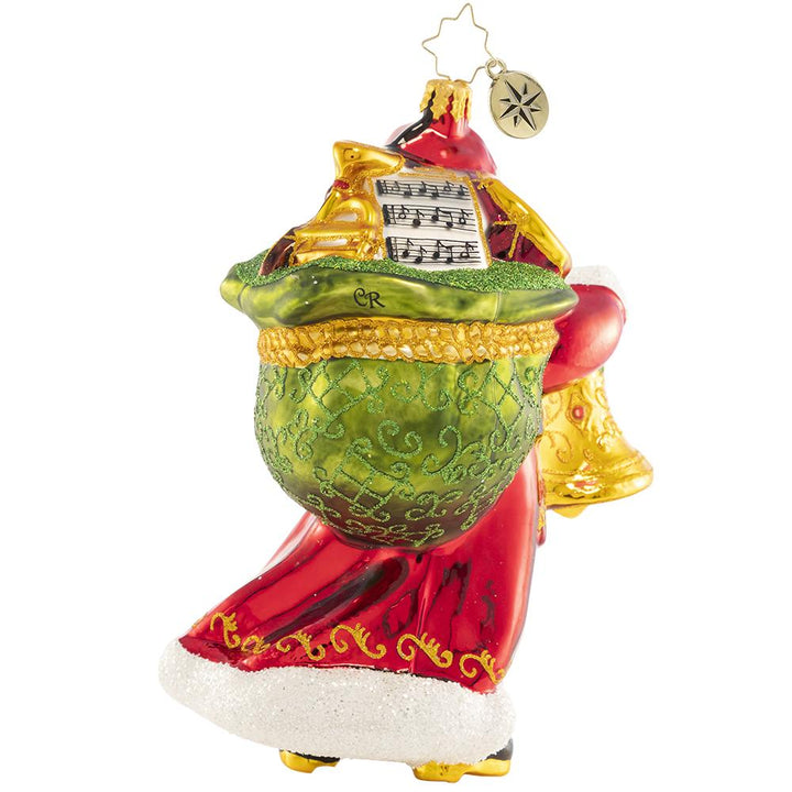 Back - Ornament Description - A Christmas Melody: Christmas bells are ringing! Santa knows that nothing brings people together quite like music, so he is spreading holiday cheer all through town with his collection of magical musical instruments. This special ornament has been hand-picked by the Radko team to be part of the Limited Edition collection.
