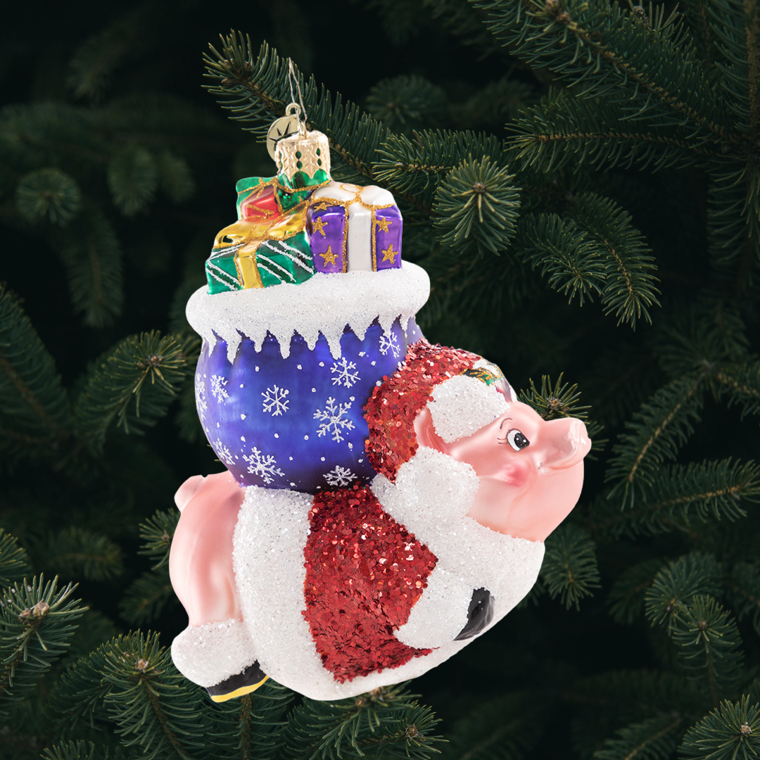 Ornament Description - When Pigs Fly!: This piggie has got serious sty-le! He is reaching for the sky and proving that with the help of a little Christmas magic, nothing is impossible!