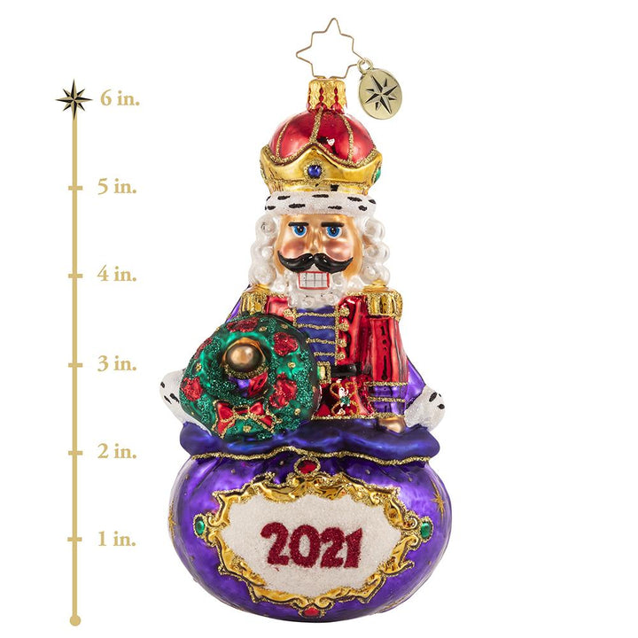 Ornament Description - Imperial Icon Nutcracker 2021: Ever the dutiful servant, this noble nutcracker watches over Santa's sack of treasures. He takes his job seriously, but he cannot help 'cracking' a smile! This photo shows the ornament is about 6 inches tall. 