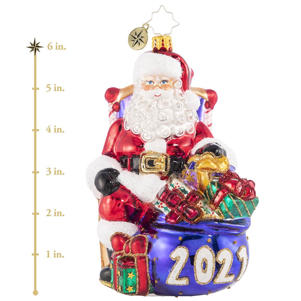 Ornament Description - Kick Back And Relax 2021: The presents have all been delivered and the reindeer are fast asleep in their stalls. Now Santa can finally relax and reflect, which he does best from his biggest, comfiest chair! This photo shows the ornament is about 6 inches tall. 