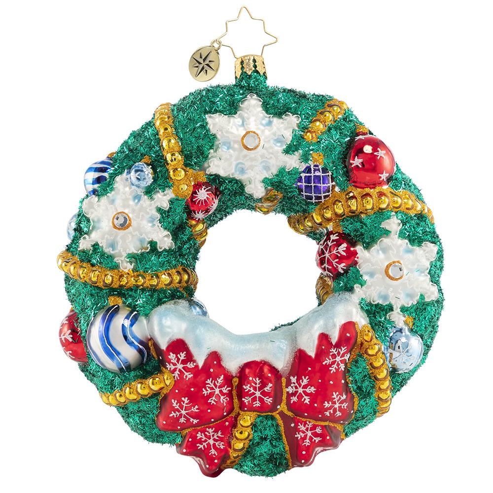 Front - Ornament Description - Flurry of Flakes: A surprise flurry has passed through town, frosting everything in sight! This dazzling holiday wreath stands out despite all the snow!