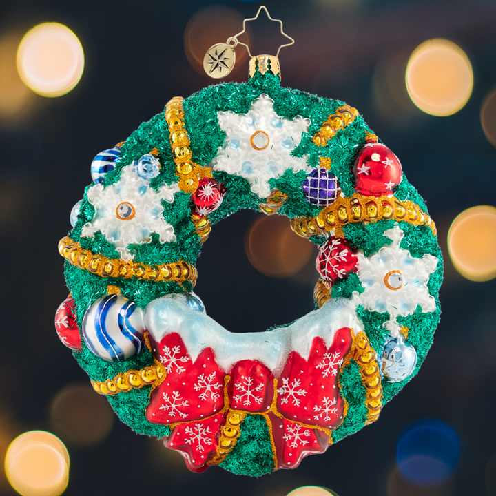 Ornament Description - Flurry of Flakes: A surprise flurry has passed through town, frosting everything in sight! This dazzling holiday wreath stands out despite all the snow!