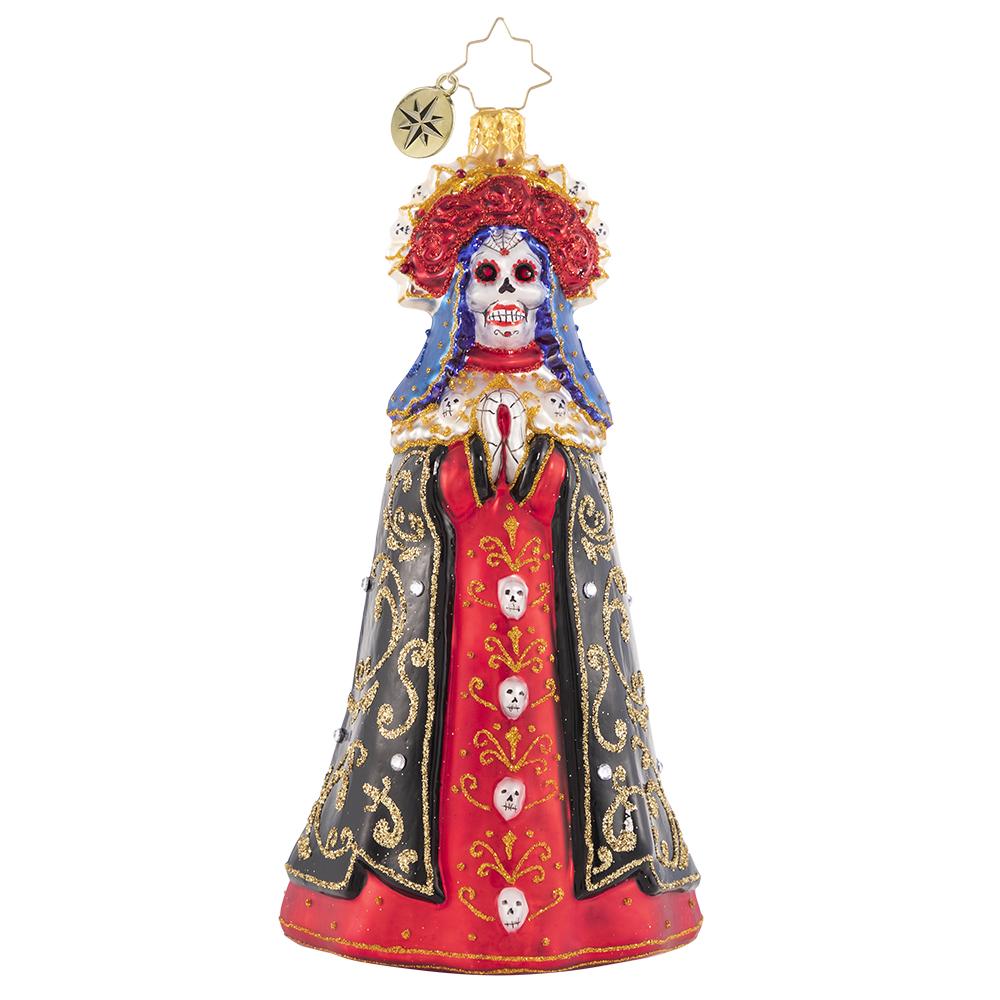 Front - Ornament Description - Lady of Shadows: Diosa mia! Crowned with a gilded flower halo and traditional threads of gold, La Catrina arrives to pay tribute at the altar.