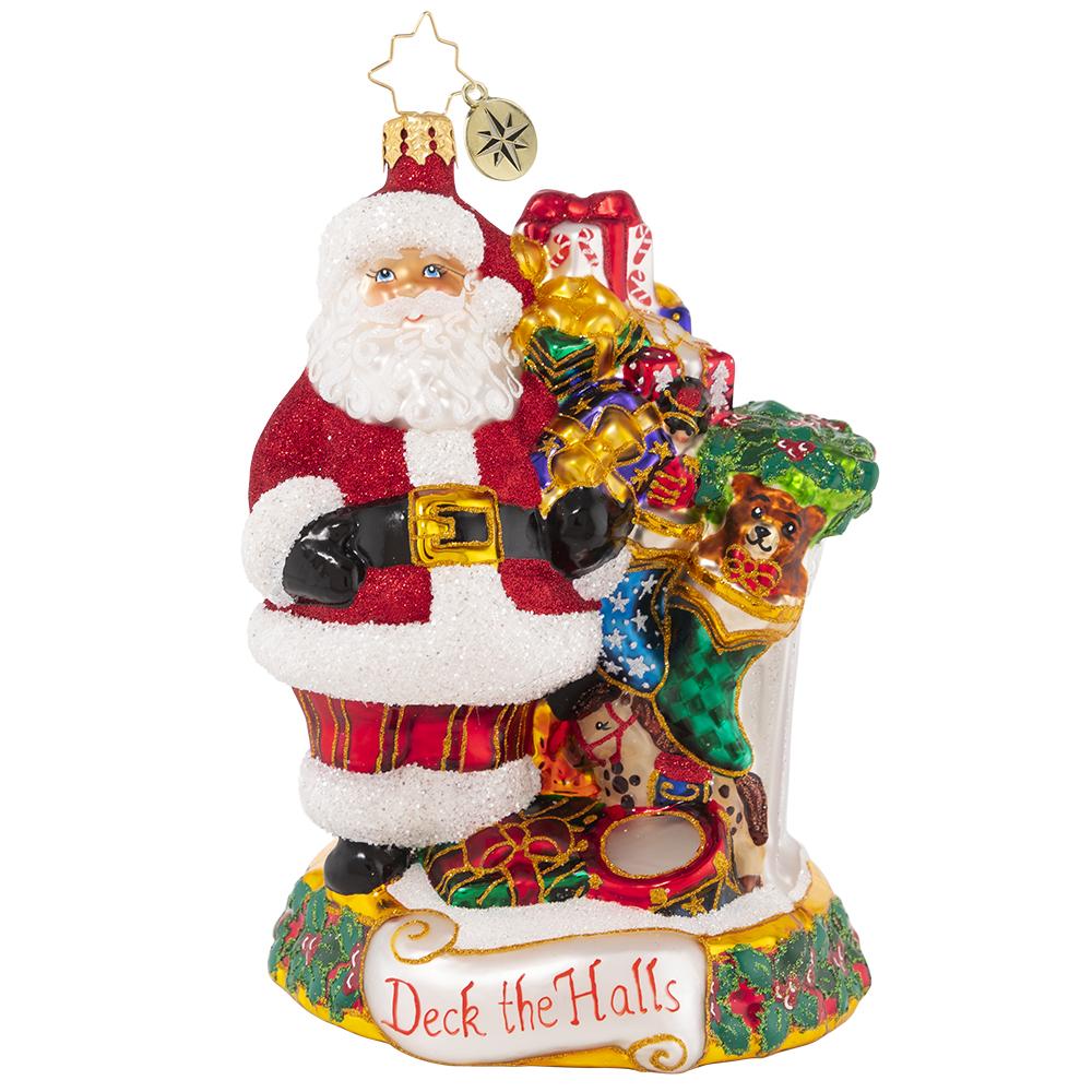 Front - Ornament Description - Masterpiece By The Mantle: The stockings were hung by the chimney with care, in hopes that Saint Nicholas soon would be there--and here he is! Santa takes care to fill each stocking with toys and treats to surprise and delight on Christmas morning.