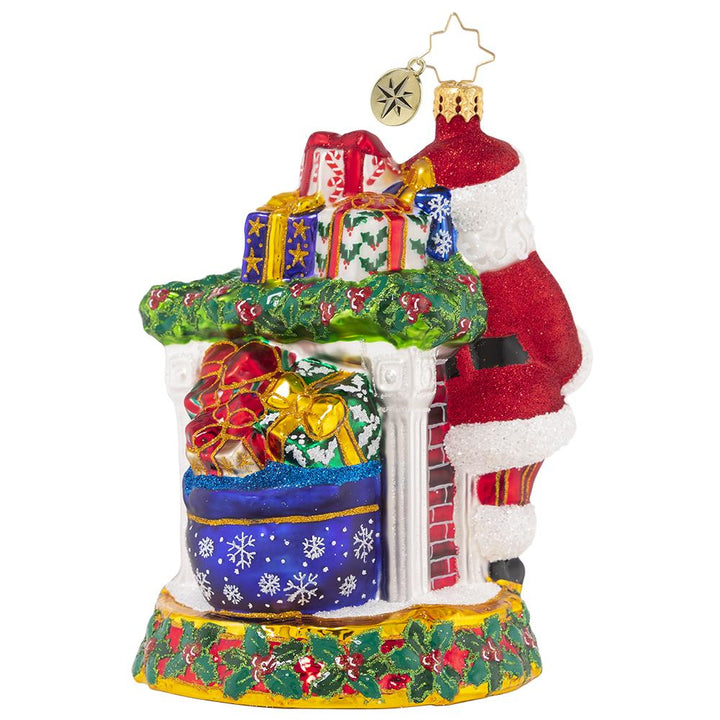 Back - Ornament Description - Masterpiece By The Mantle: The stockings were hung by the chimney with care, in hopes that Saint Nicholas soon would be there--and here he is! Santa takes care to fill each stocking with toys and treats to surprise and delight on Christmas morning.