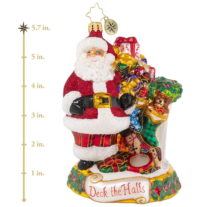 Ornament Description - Masterpiece By The Mantle: The stockings were hung by the chimney with care, in hopes that Saint Nicholas soon would be there--and here he is! Santa takes care to fill each stocking with toys and treats to surprise and delight on Christmas morning. This photo shows the ornament is about 5.7 inches tall. 