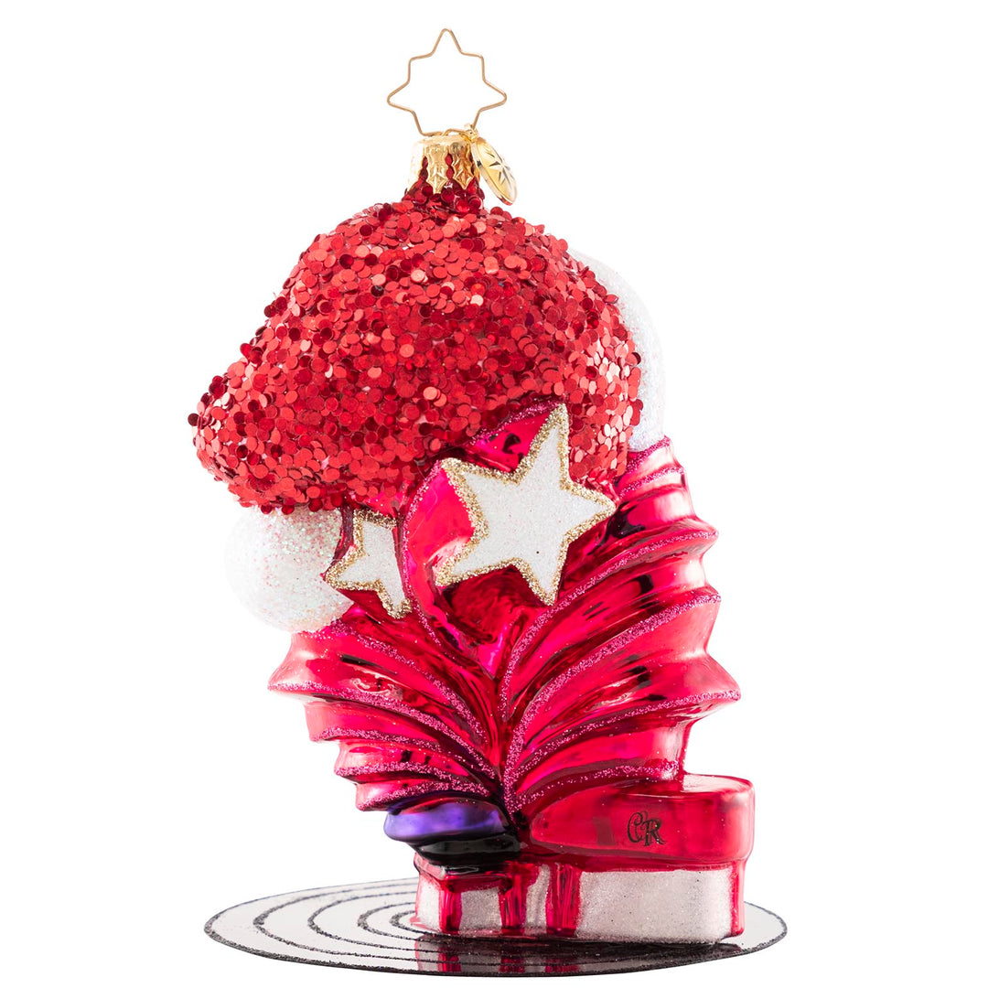 Back - Ornament Description - Elton John's Center Stage: Donning a Santa hat and his signature shades, Elton John takes center stage for a holiday concert of some of his greatest hits. He is ready to Step Into Christmas and will have the crowd Crocodile Rockin' in no time!