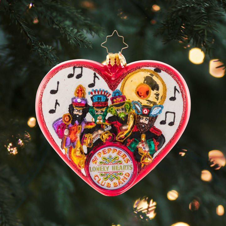 Ornament Description - We're With The Band: We all get by with a little help from our friends-- John, Paul, George, and Ringo of course! The band is at it again to ring in Christmas with this playful ornament. No Lonely Hearts here!