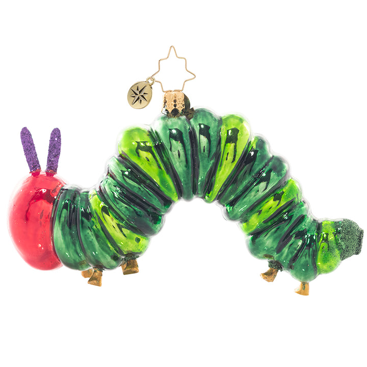 Back - Ornament Description - It all started with one apple. The Very Hungry Caterpillar™ has inspired generations to discover and explore the world around them. Let this unique piece inspired by Eric Carle’s art spark your imagination and color your life! © 2021 Penguin Random House LLC. ERIC CARLE, THE VERY HUNGRY CATERPILLAR, THE WORLD OF ERIC CARLE logo,